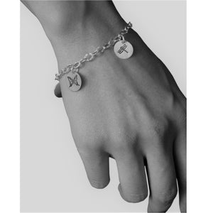 Sterling silver charm bracelet.  Showcasing dragonfly and butterfly symbols.