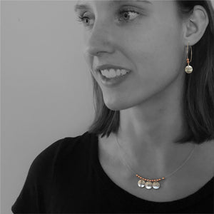 Mini Circle Earrings on Model.  Copper accent beads.  Dragonfly symbol pictured here.