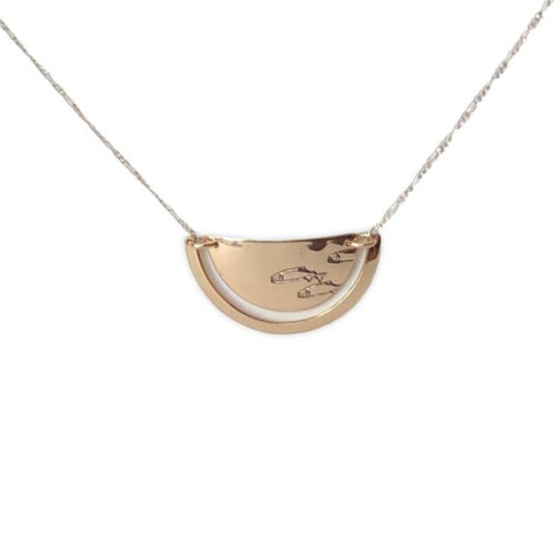 14 karat gold-fill and sterling silver Sunrise Ulu Necklace. Salmon spawning symbol pictured here.