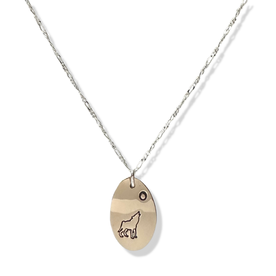 Vertical Oval Gold Filled Pendant with a Wolf symbol, on a sterling silver chain.