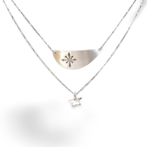 Two layered necklace.   Crescent shaped pendant with a snowflake and below it a star pendant..