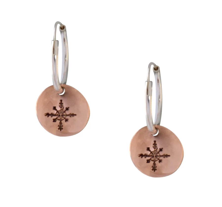 Copper and sterling silver round earrings with Canadian symbols.  Snowflake symbol pictured here.
