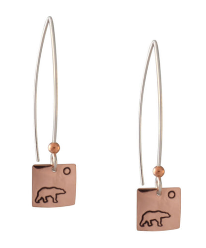 Copper and sterling silver round earrings with Canadian symbols.  Polar bear symbol pictured here.